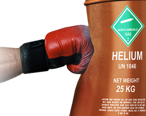 Fist in boxing glove hitting and denting a large canister of helium.