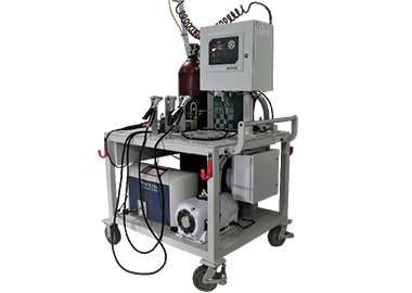 Image showing nitrogen purge test application, TracerMate instrument, clamshell clamps and tracer gas containers on a cart