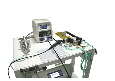 Image showing a sniffer leak test system with a leak test instrument on a portable cart