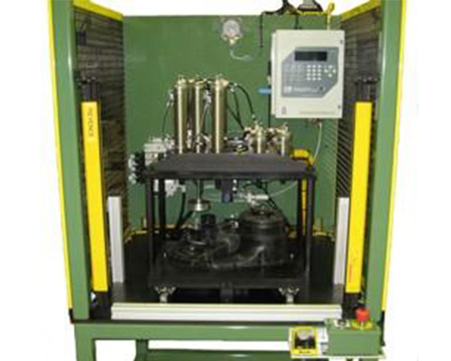 Image of a green Automotive Power Train Leak Testing equipment