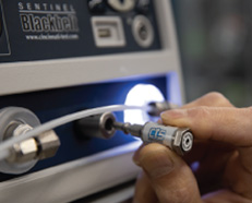 CTS Leak Standard being inserted on front of instrument