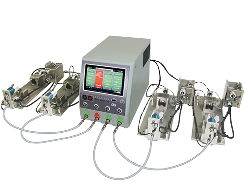 Sentinel Blackbelt benchtop with air hoses leading from each of the four bottom ports to individual small metal fixtures, shows simultaneous testing.